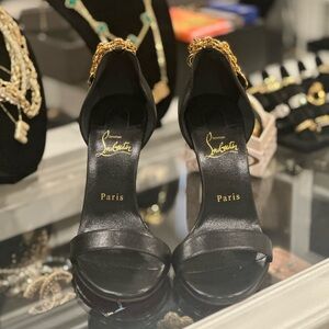 Brand new Christian Louboutin high heel pumps size 39/9 US with a gold strap